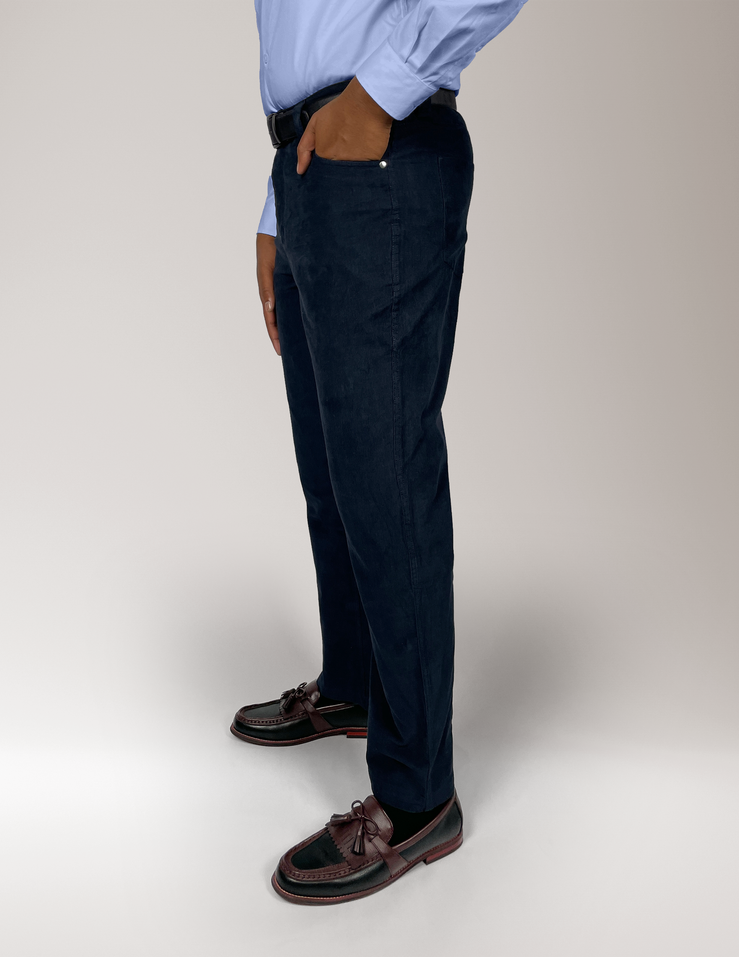 Man wearing Cordster style pants with a plain background